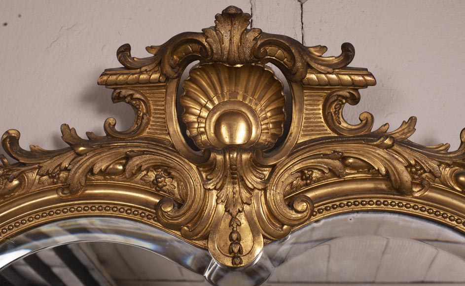 Trumeau ancien de style Napoléon III, en stuc doré et miroir biseauté-1