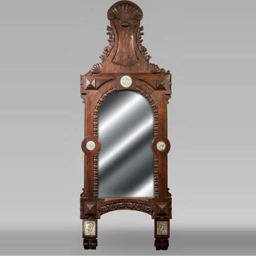 DECK Théodore, miroir monumental en chêne orné de médaillons en faïence verte