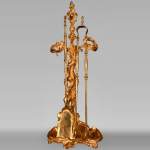Serviteur de cheminée en bronze doré de style Louis XV
