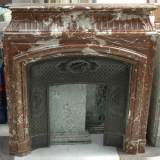 Cheminée ancienne de style Louis XIV en marbre Rouge du Nord