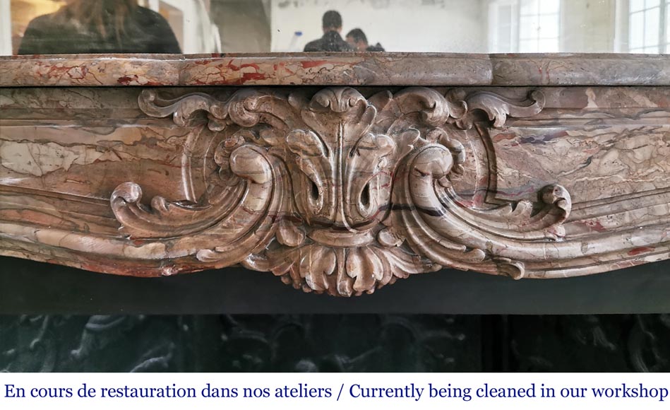 Cheminée ancienne de style Louis XV richement ornée en marbre Sarrancolin-1