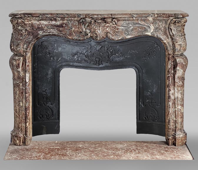 Cheminée d'époque Louis XV en marbre Rouge Royal décorée de cartouches asymétriques-0
