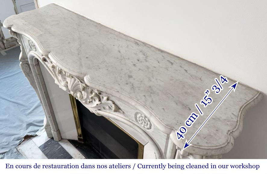 Cheminée de style Louis XV ornée d'une large coquille-12